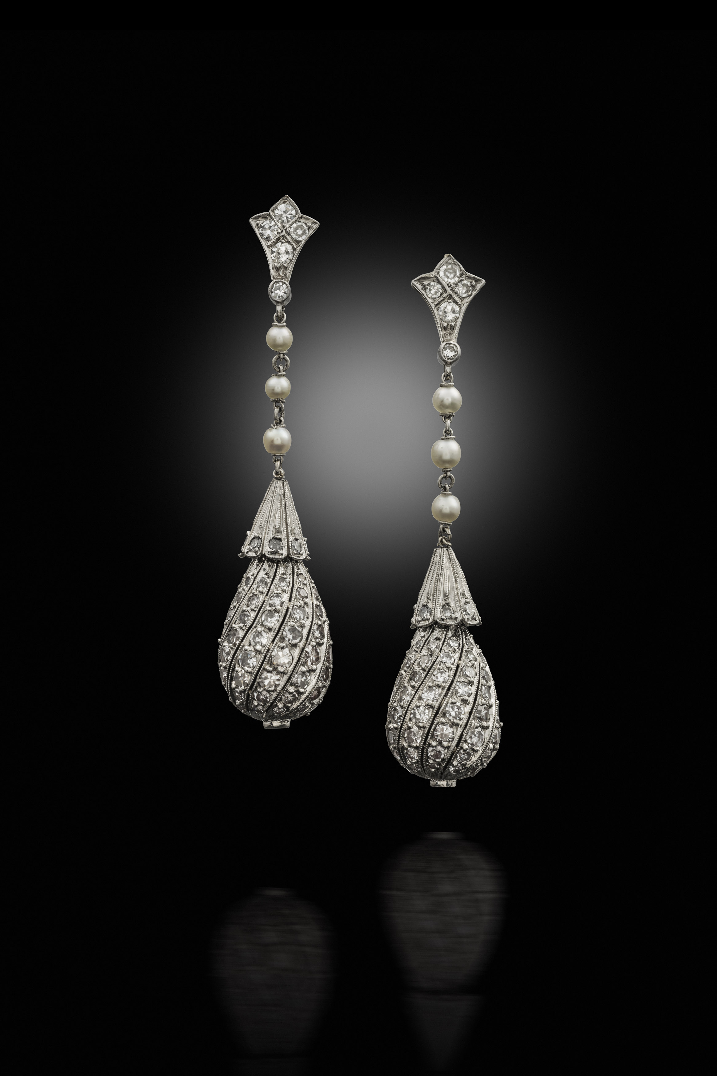 A pair of early 20th century diamond and seed pearl pendant earrings