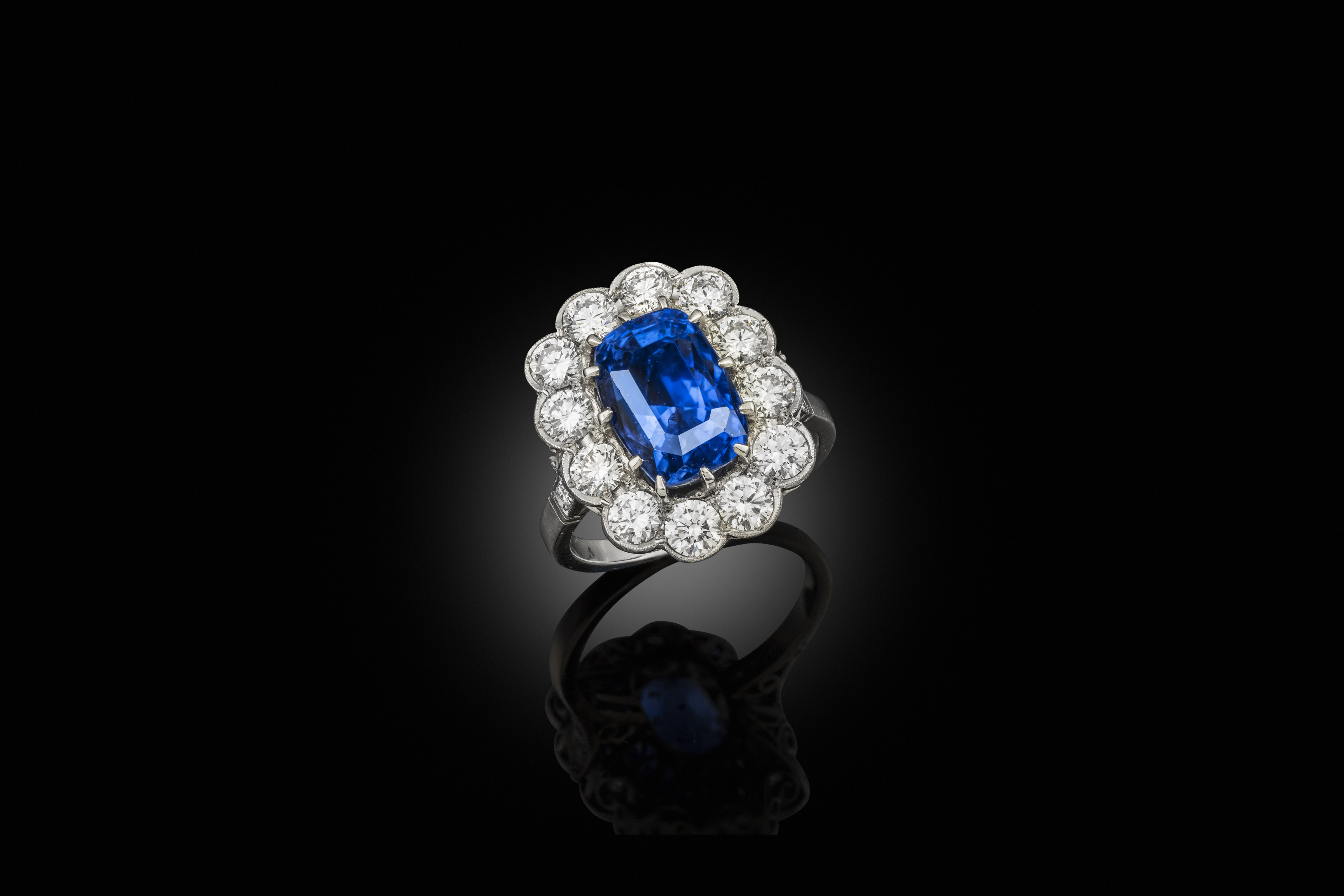 A mid century sapphire and diamond cluster ring