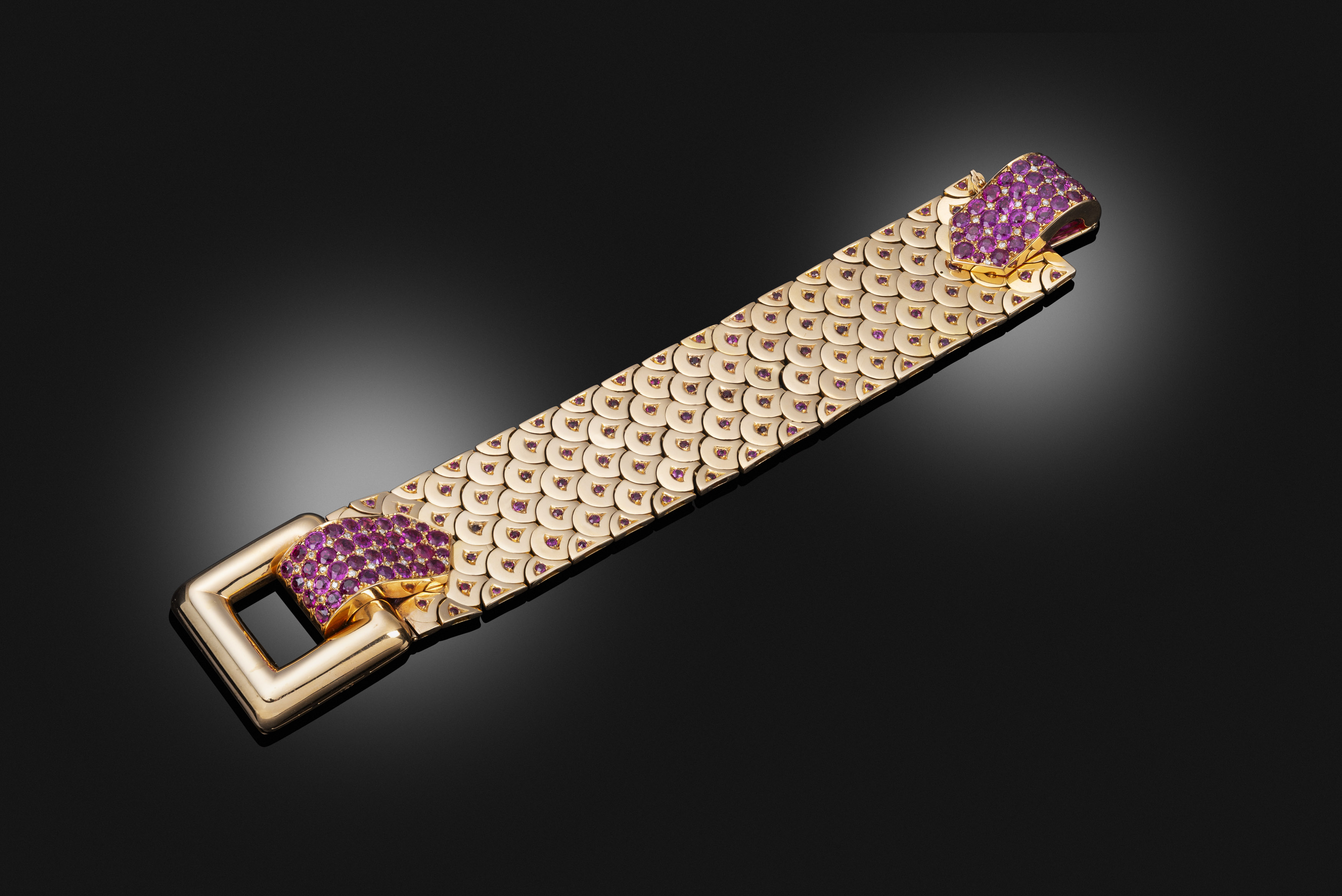 A 1940s gold and ruby strap bracelet