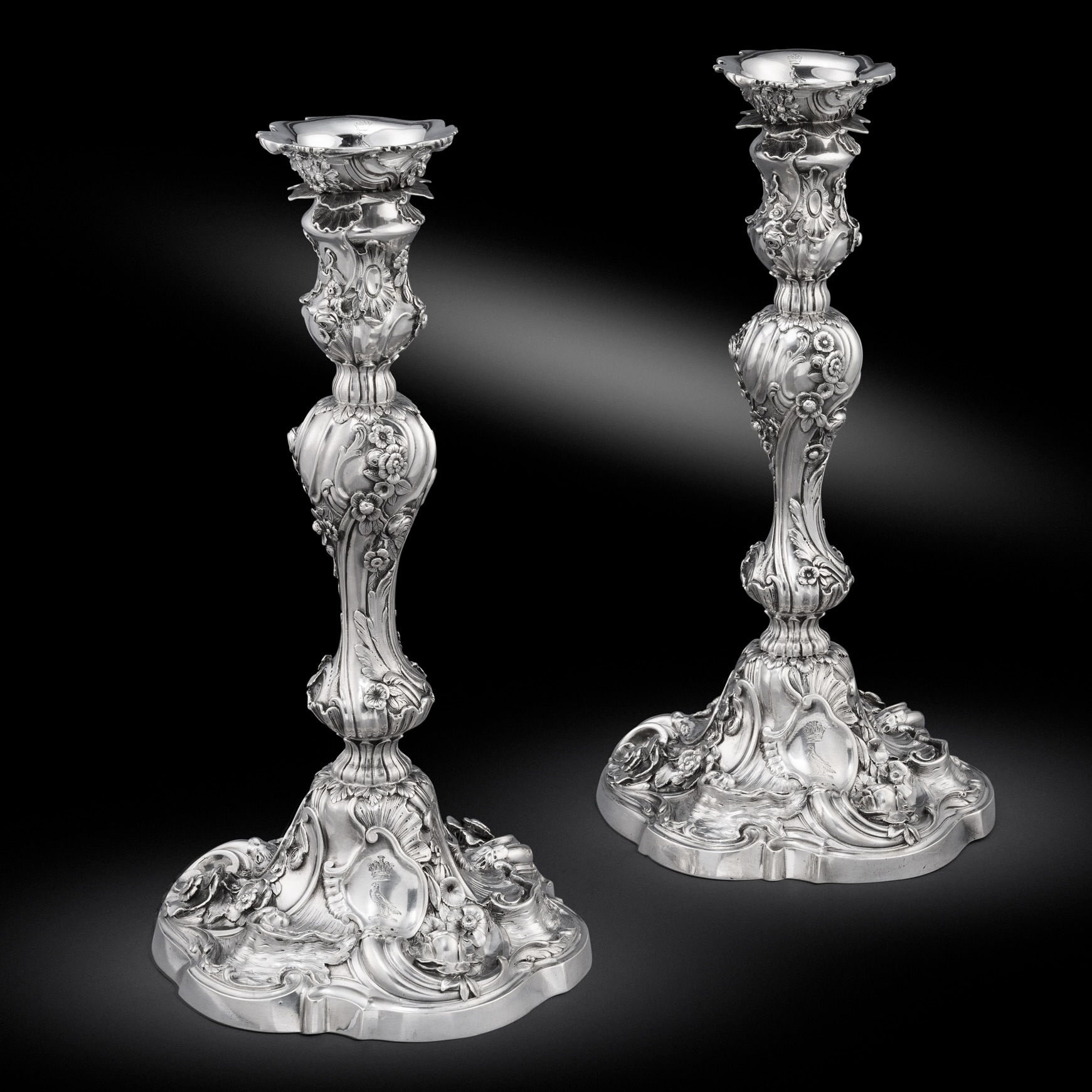 A Pair of George II cast candlesticks