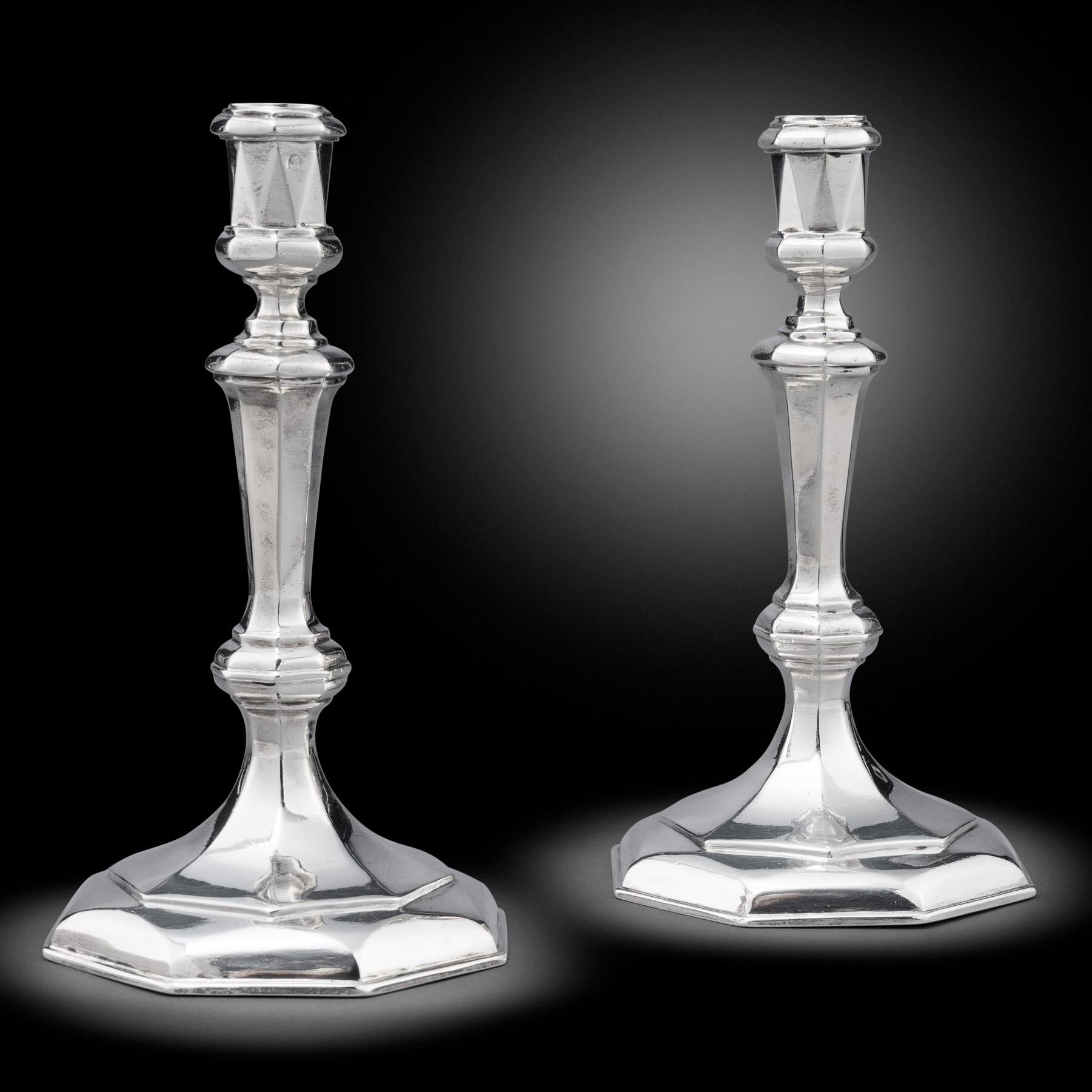 A Pair of Queen Anne Britannia standard cast candlesticks
