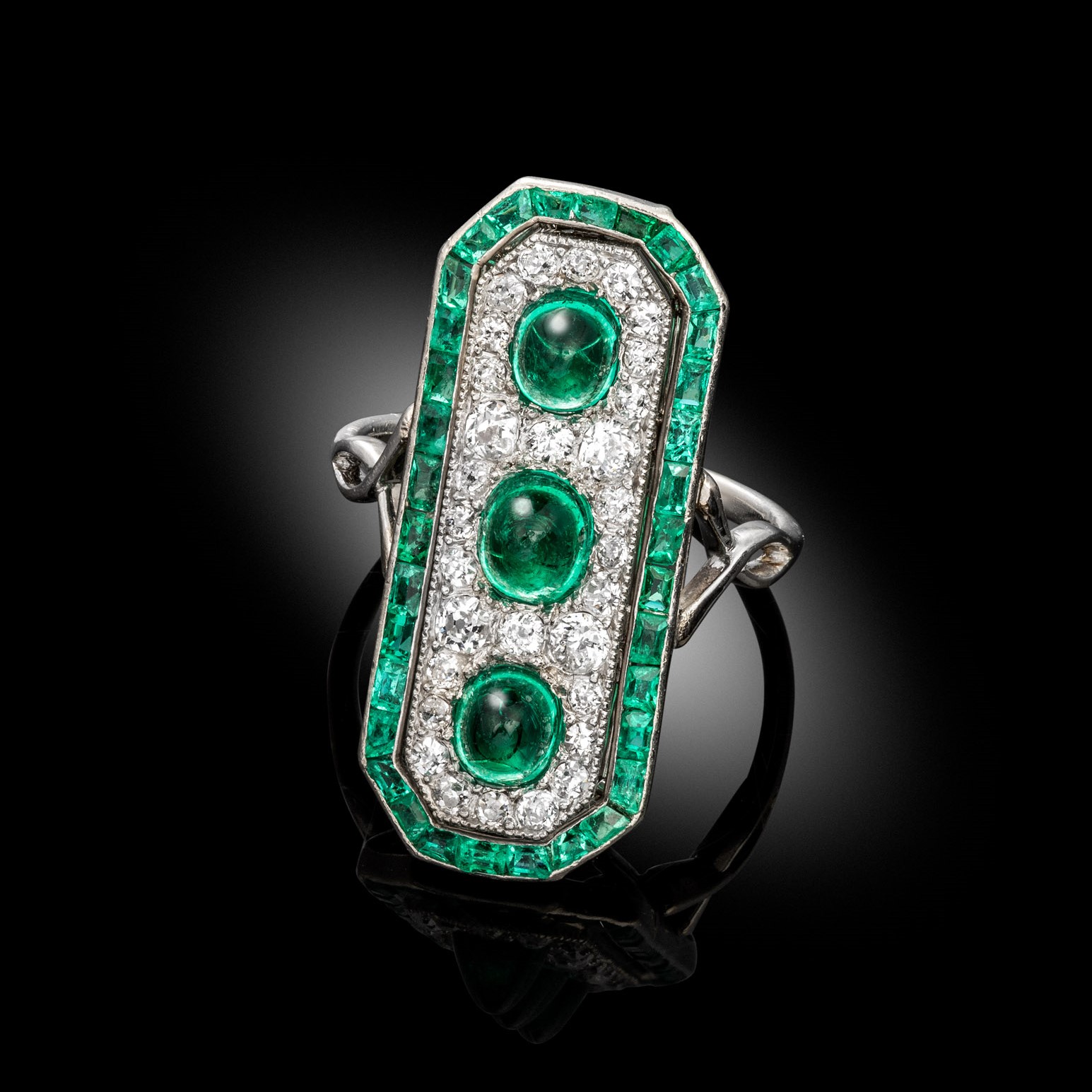 An art deco emerald and diamond plaque ring, circa 1930