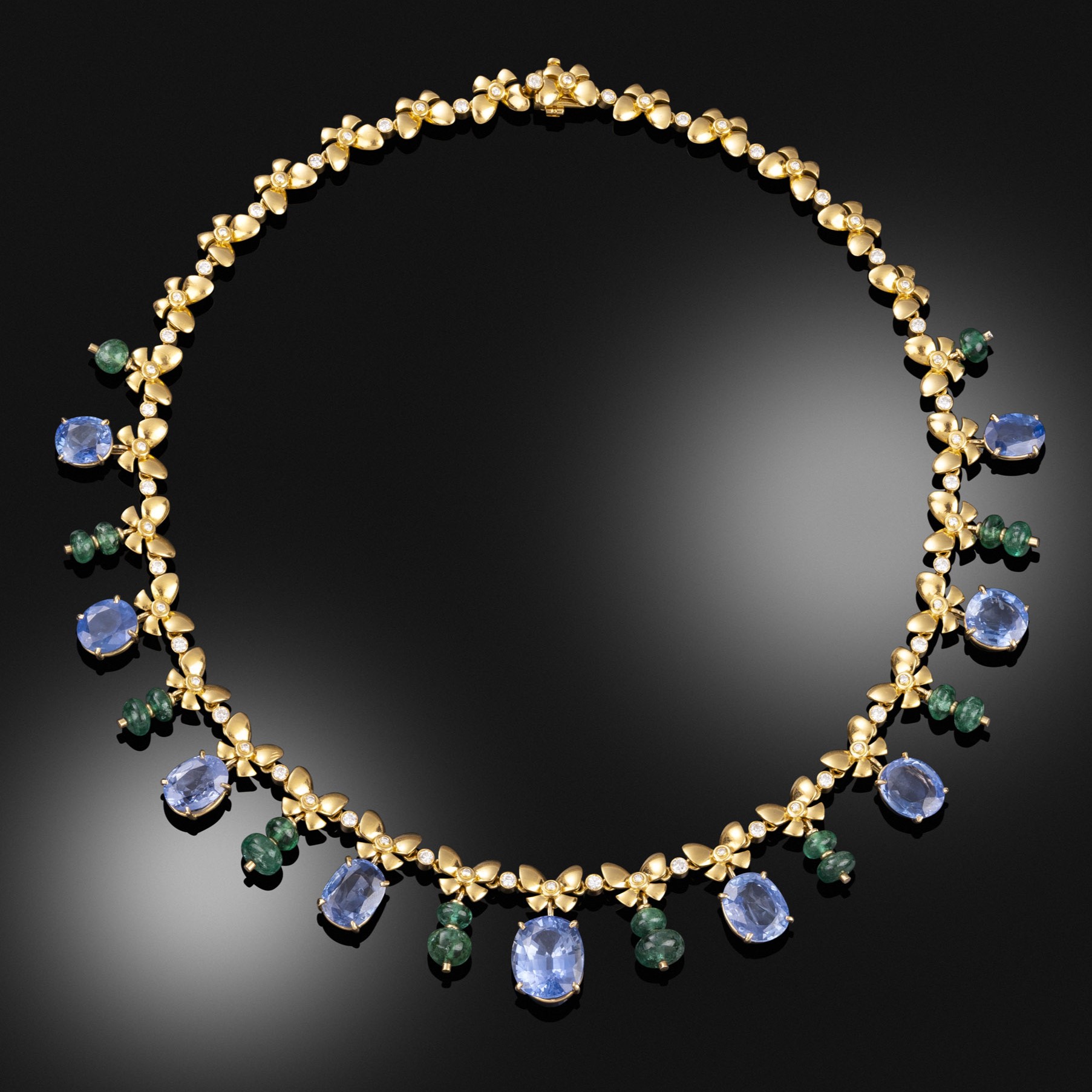 A retro ceylon sapphire, emerald and diamond necklace, circa 1940