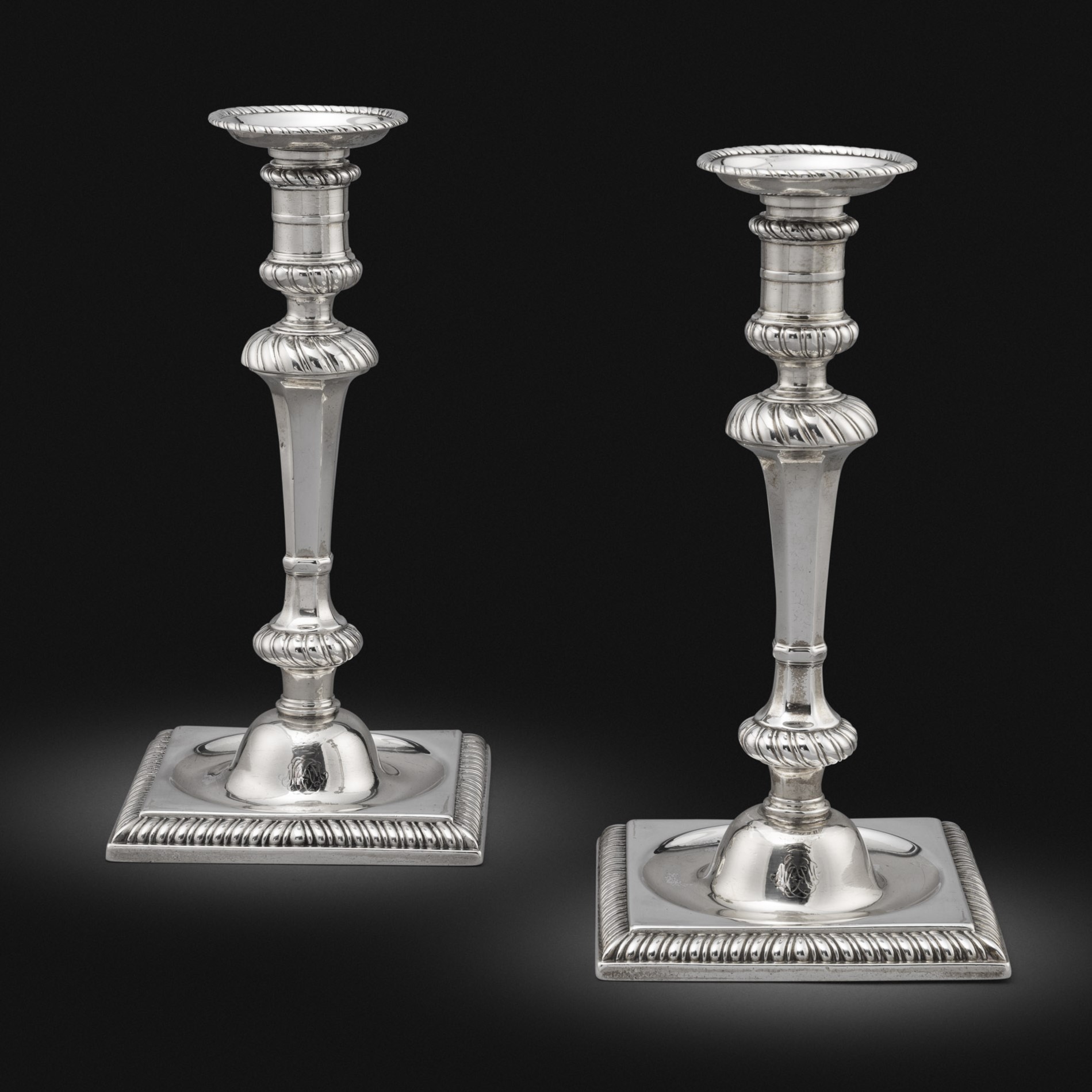 A Pair of Square-Based Irish George III Candlesticks