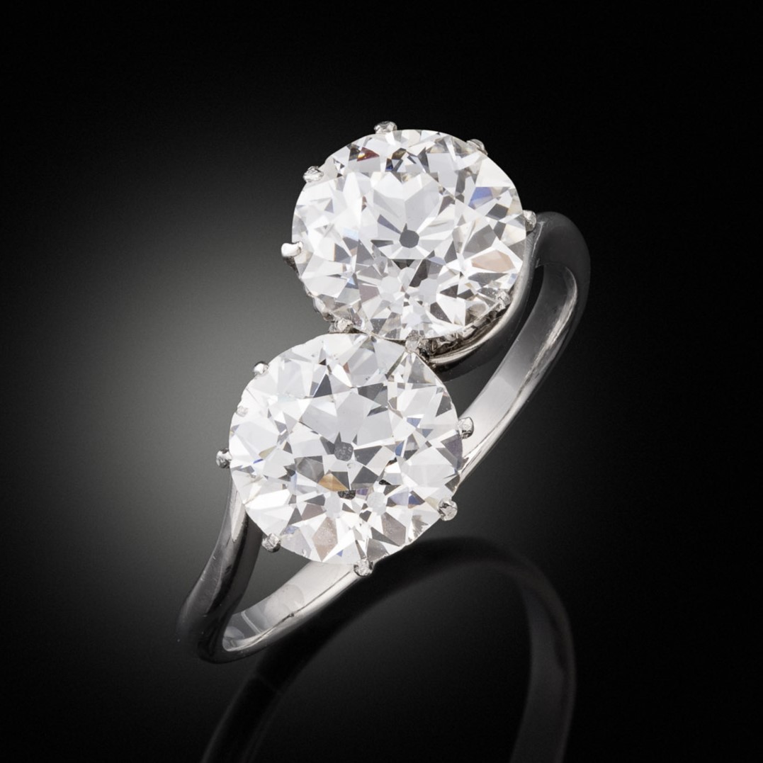 An old cut diamond toi et moi ring, circa 1910