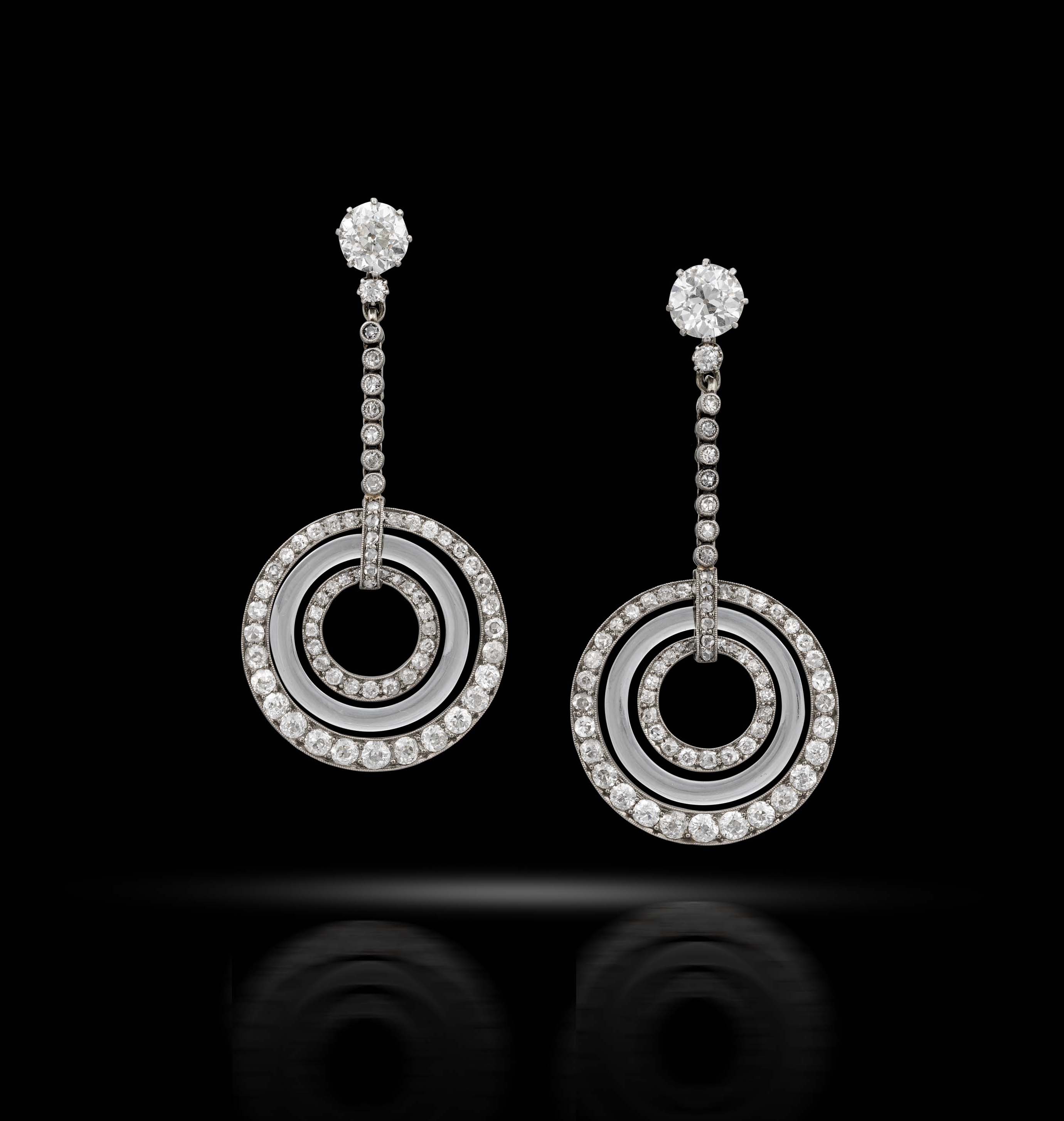 A pair of art deco diamond and rock crystal ear pendants, circa 1920