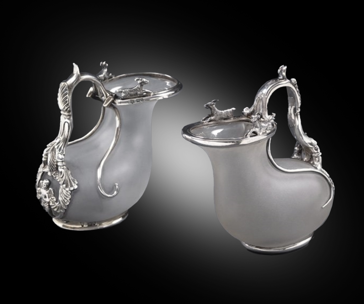 A Pair of Silver-Mounted Ascos Jugs