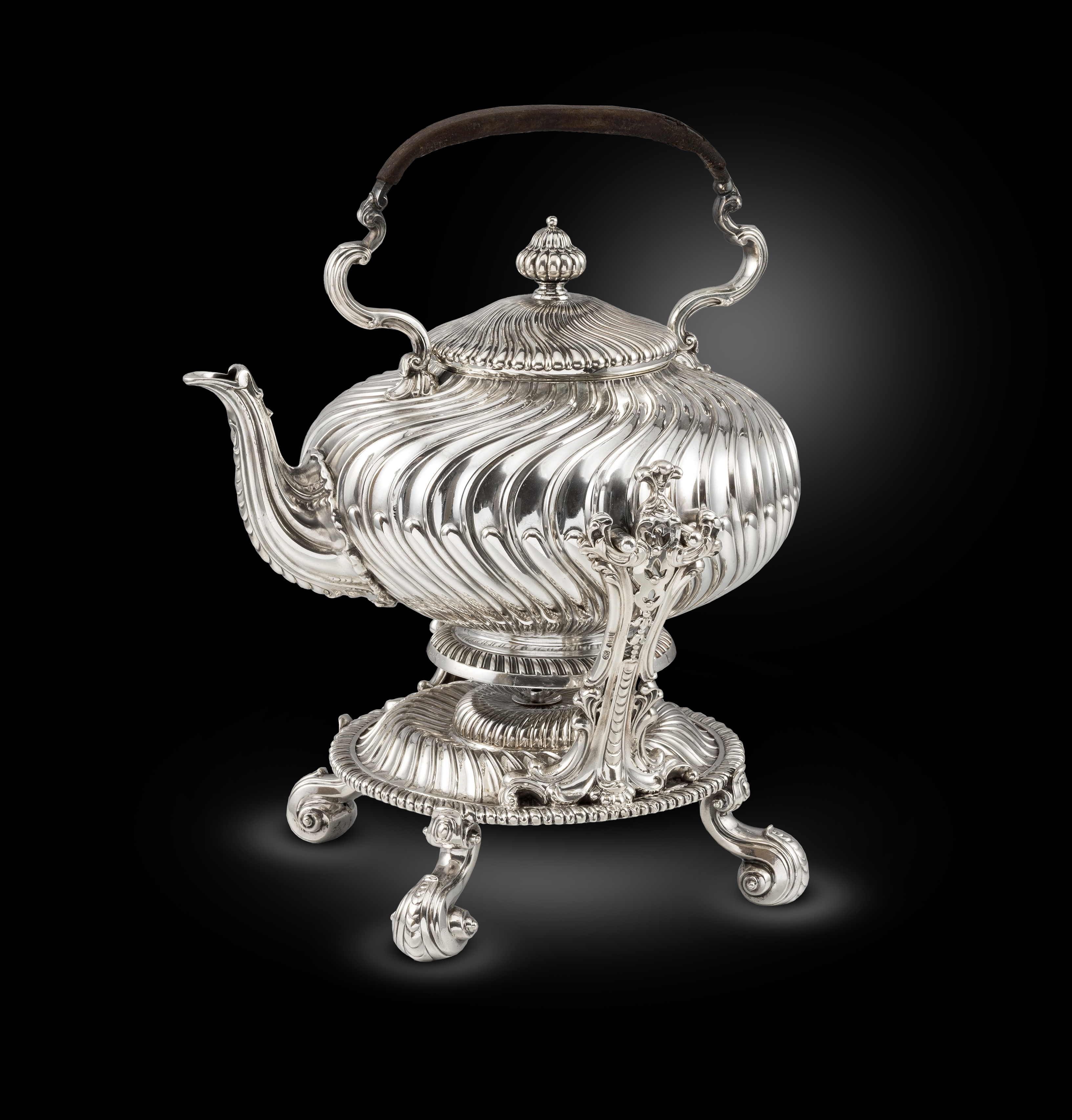 A Swirling Fluted Kettle on Stand 