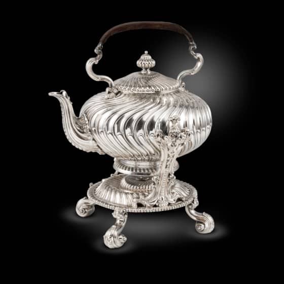 A Swirling Fluted Kettle on Stand