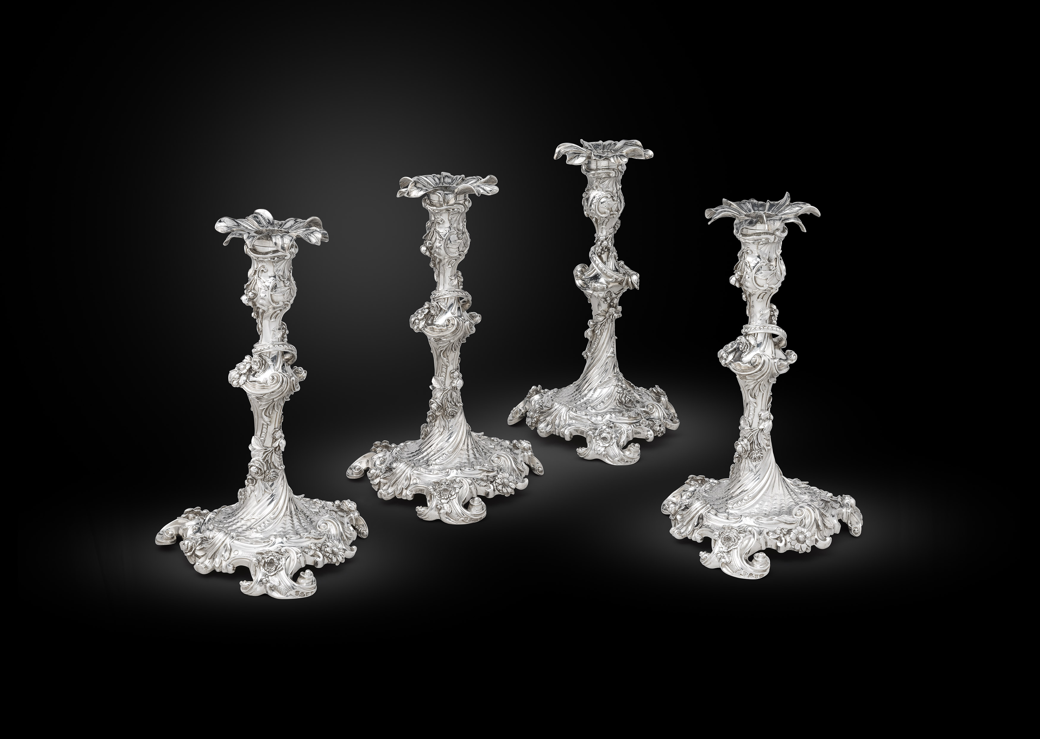 An Exquisite Set of Four Rococo Candlesticks