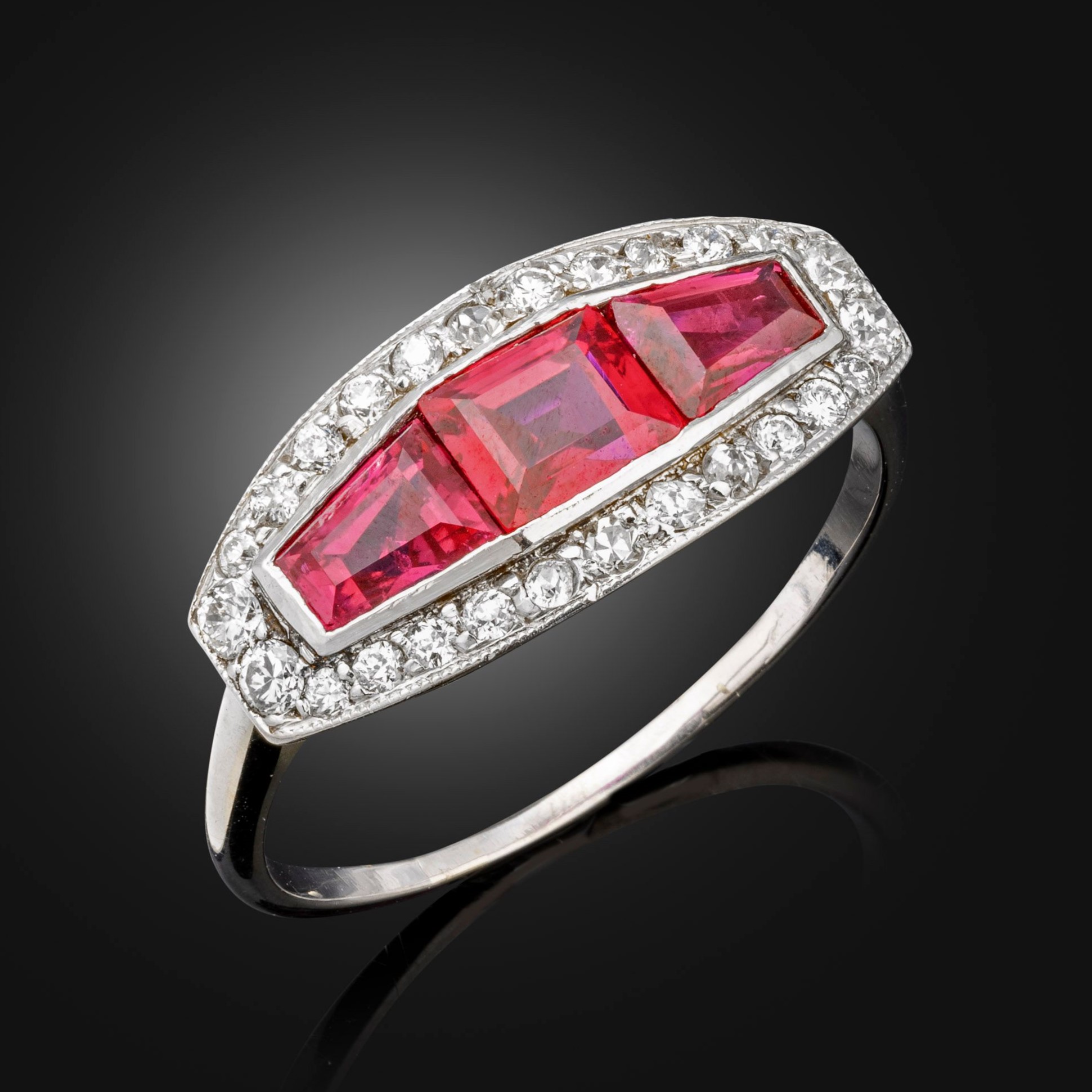An art deco ruby and diamond geometric cluster ring, circa 1920