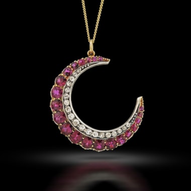 A late 19th century ruby and diamond crescent pendant