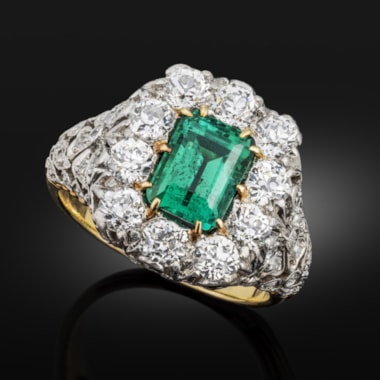 Early 20th century emerald and diamond cluster ring