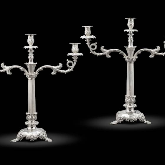 A pair of William IV silver two-light candelabra