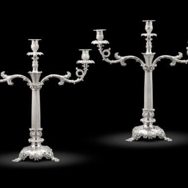 A pair of William IV silver two-light candelabra