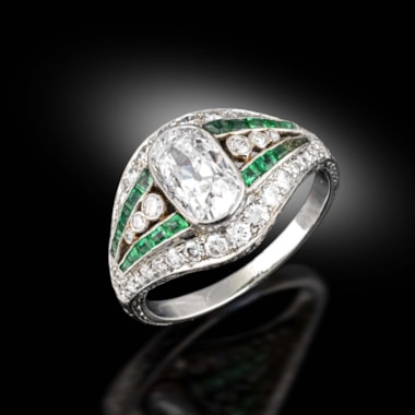An emerald and diamond ring, circa 1915