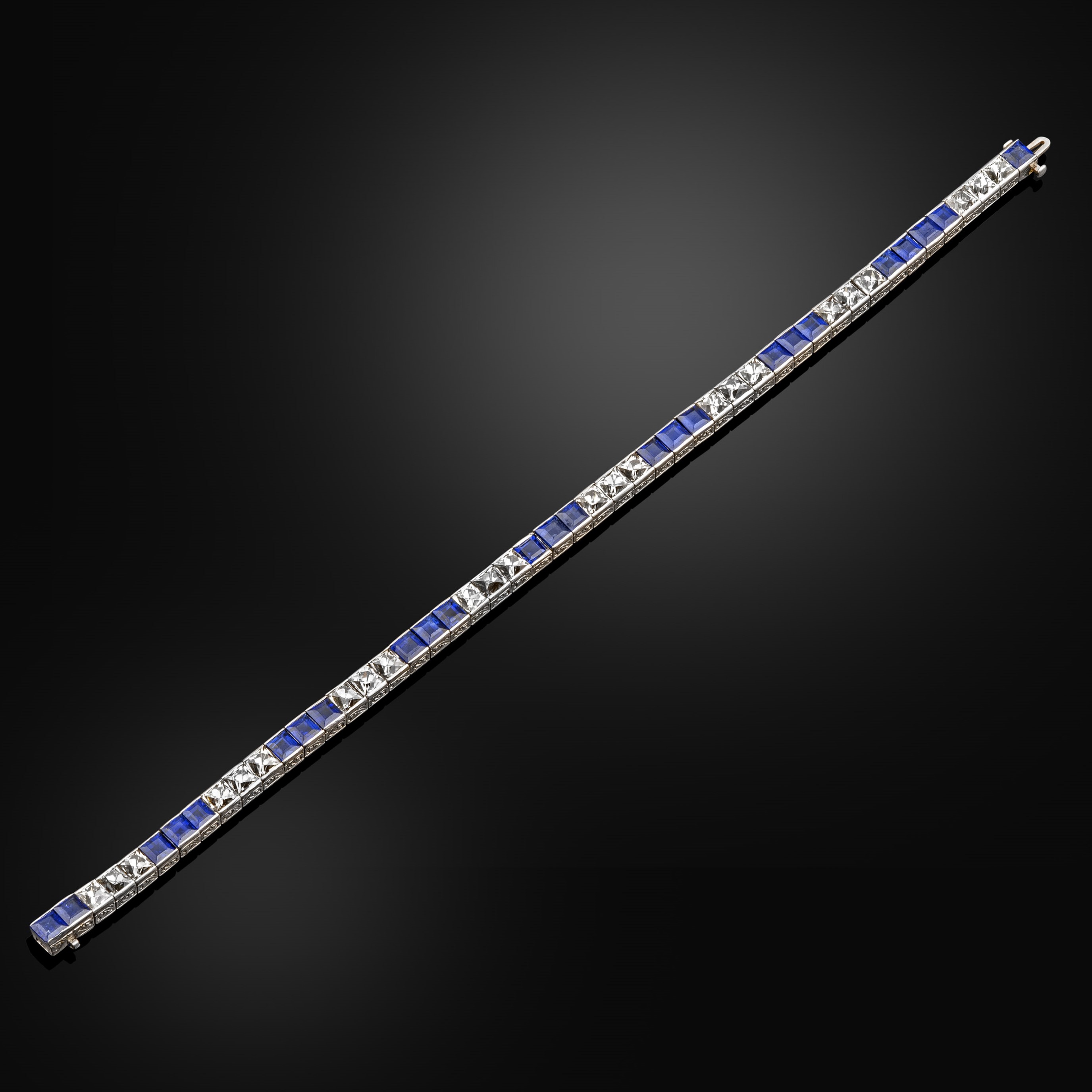 An early 20th century sapphire and French cut diamond line bracelet