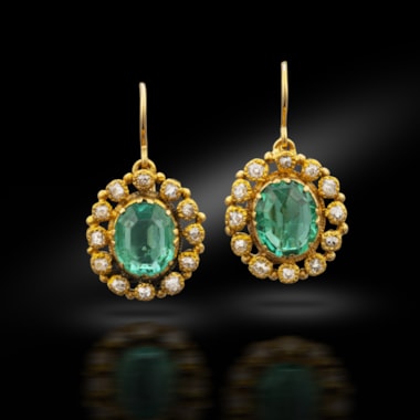 A pair of emerald and diamond cluster earrings, circa 1890