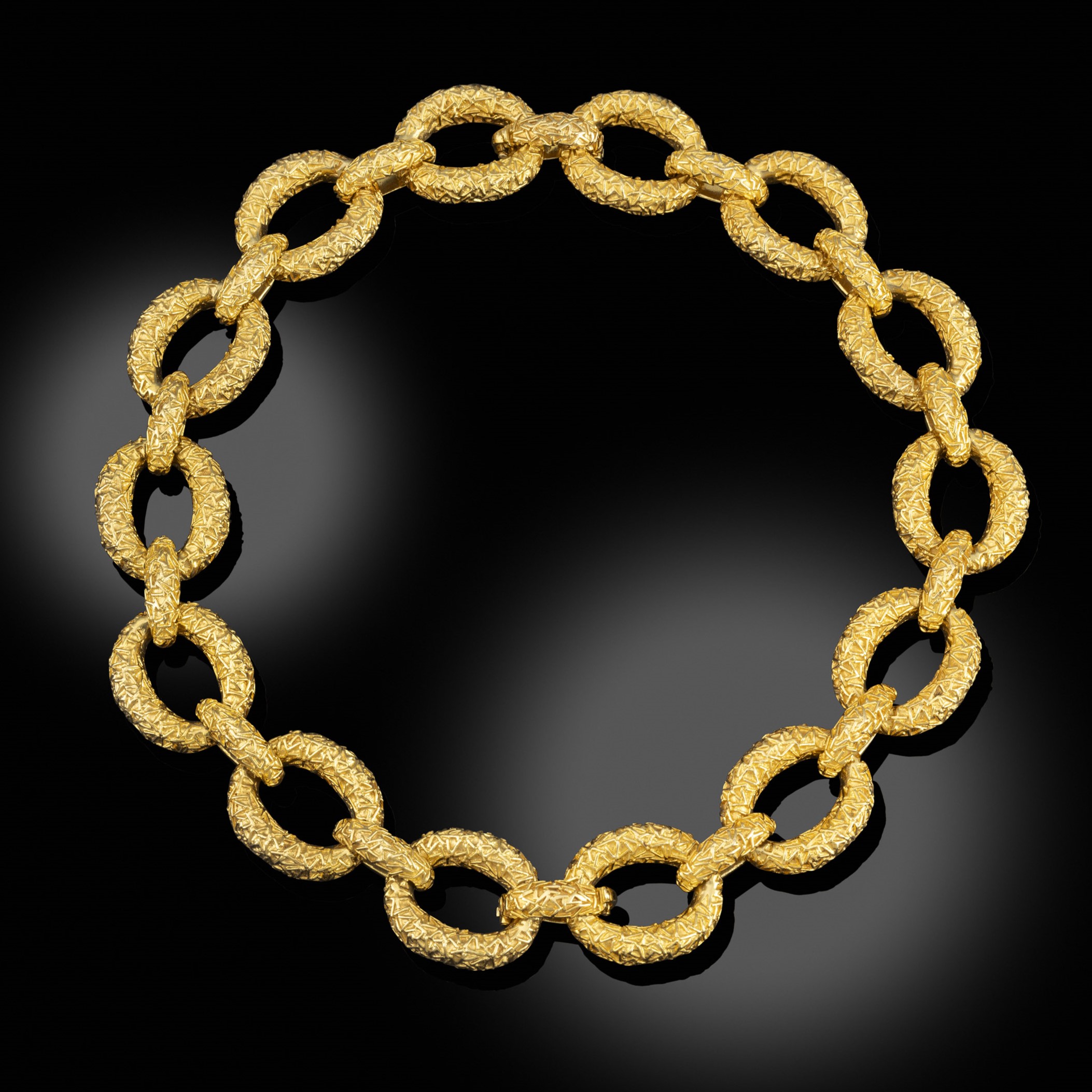 A gold and diamond necklace / pair of bracelets