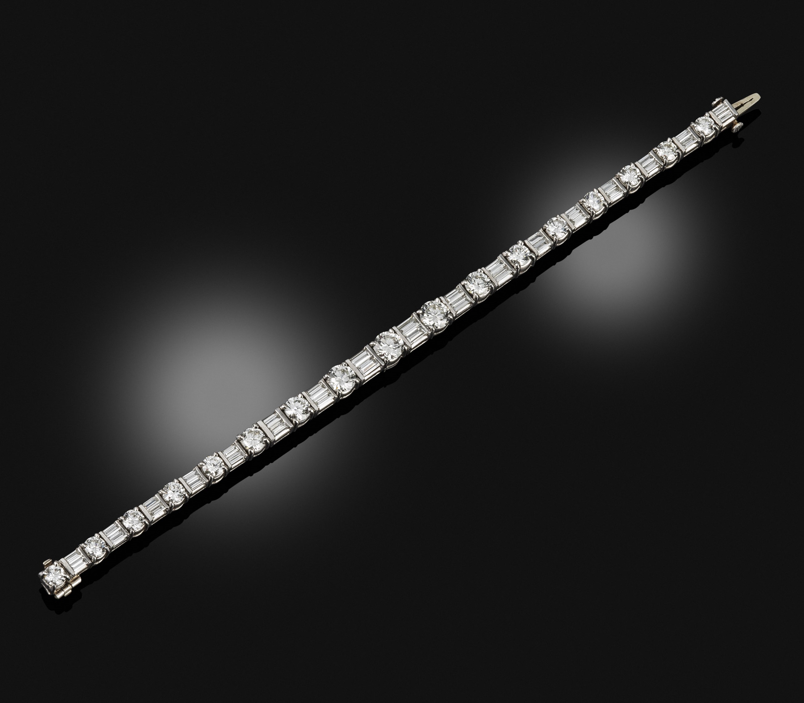 A platinum and diamond line bracelet, 1930s