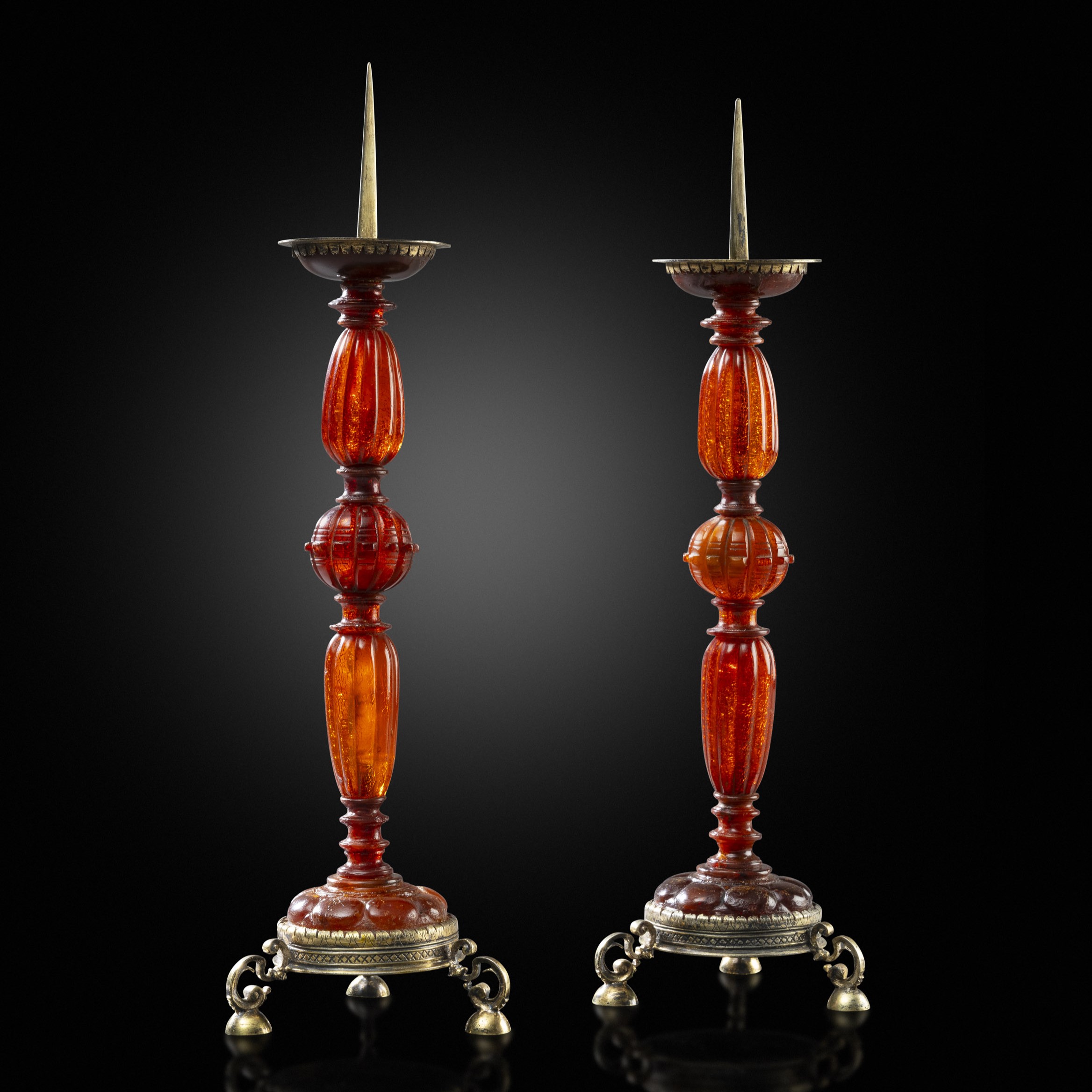 A Pair of incredibly Rare 16th Century Silver-gilt Mounted Carved Amber Pricket Candlesticks