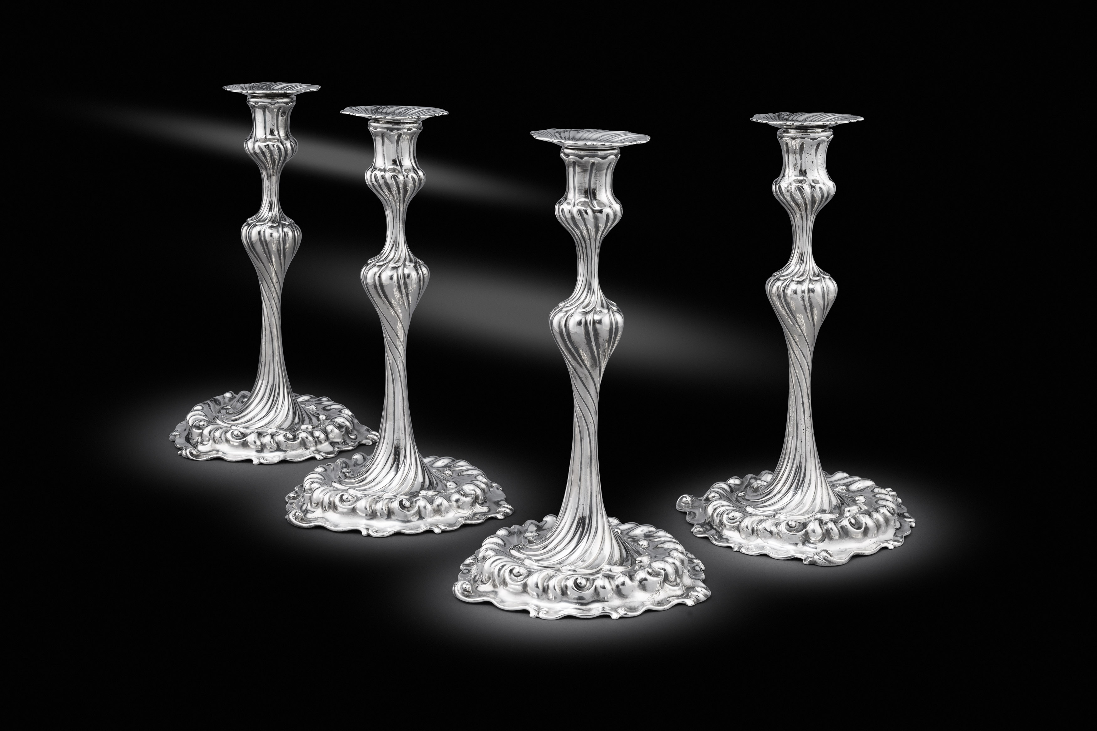A Set of Four George II Candlesticks