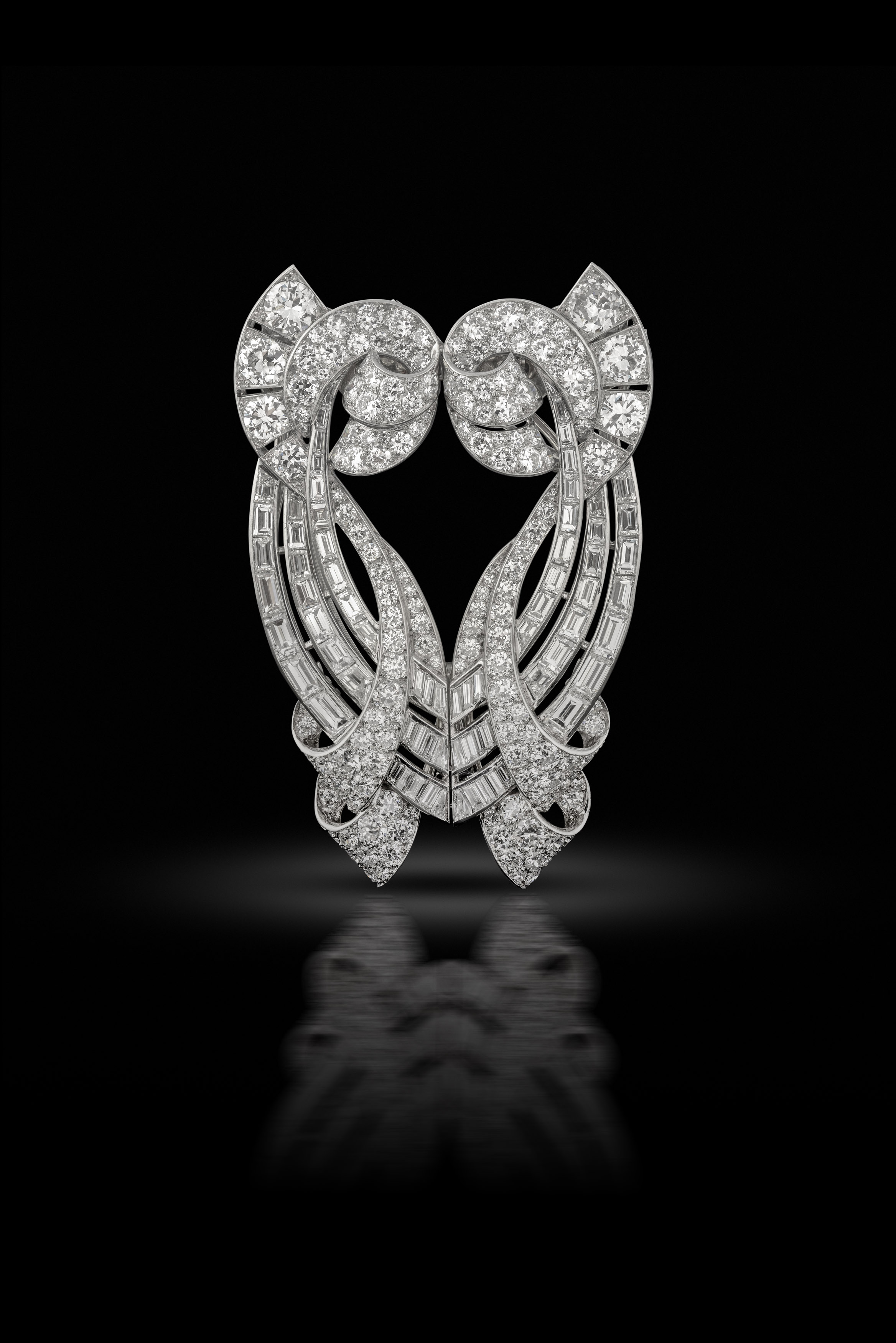 A pair of platinum and diamond double clip brooches, circa 1935