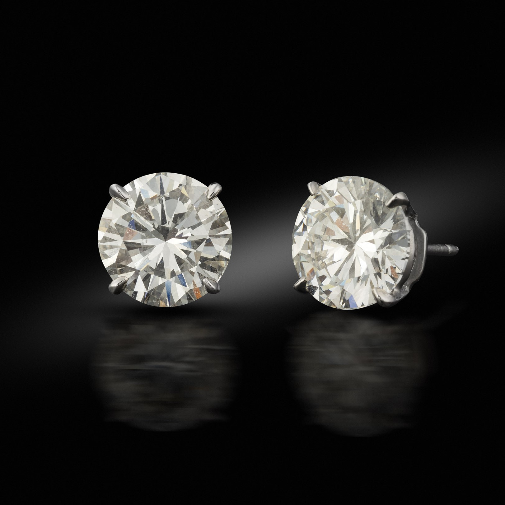 A pair of 3.00 carat diamond studs