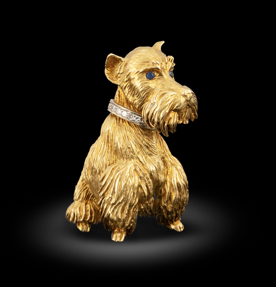 A gold, sapphire and diamond dog brooch