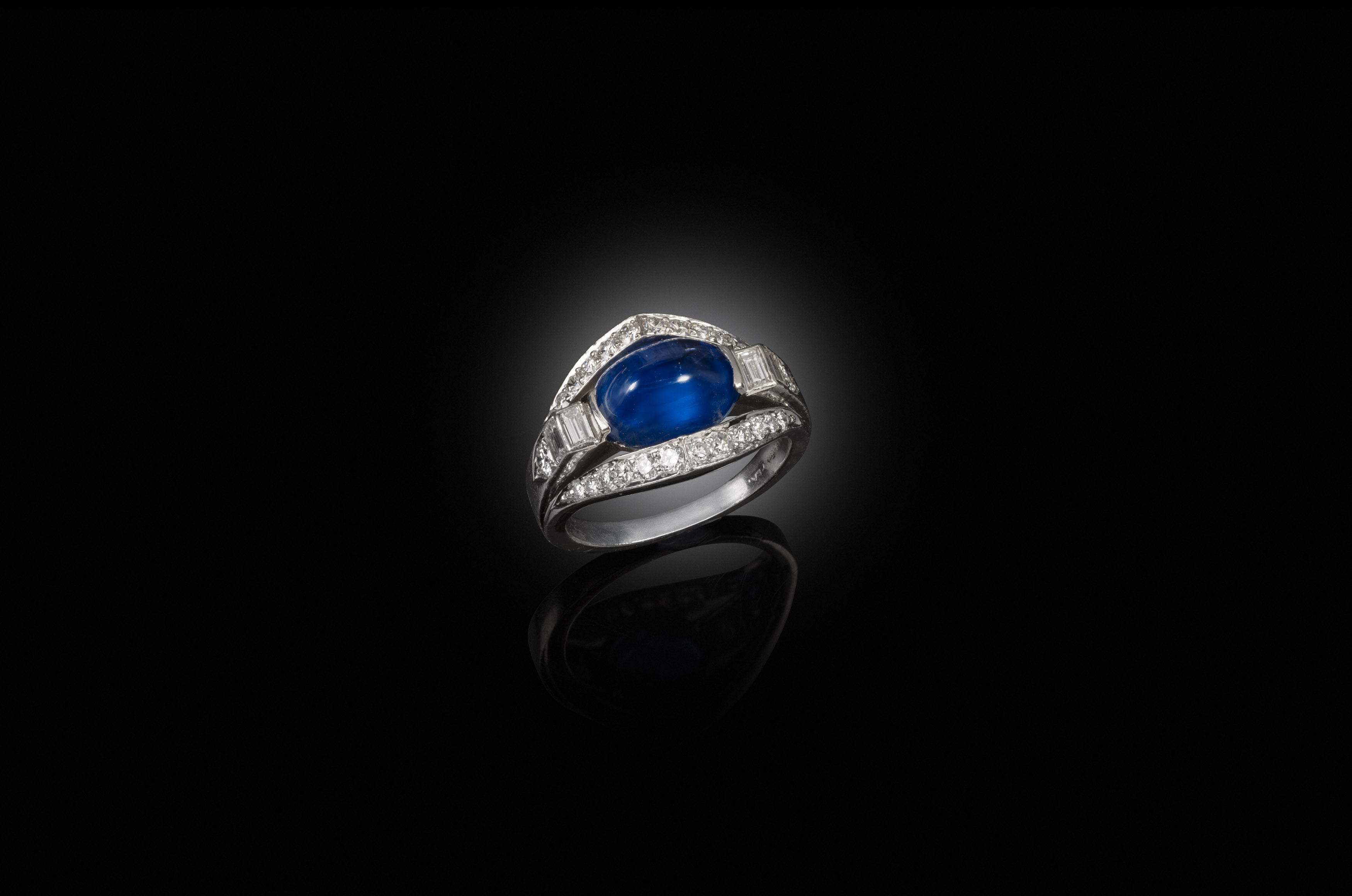 A 1930s cabochon sapphire and diamond ring