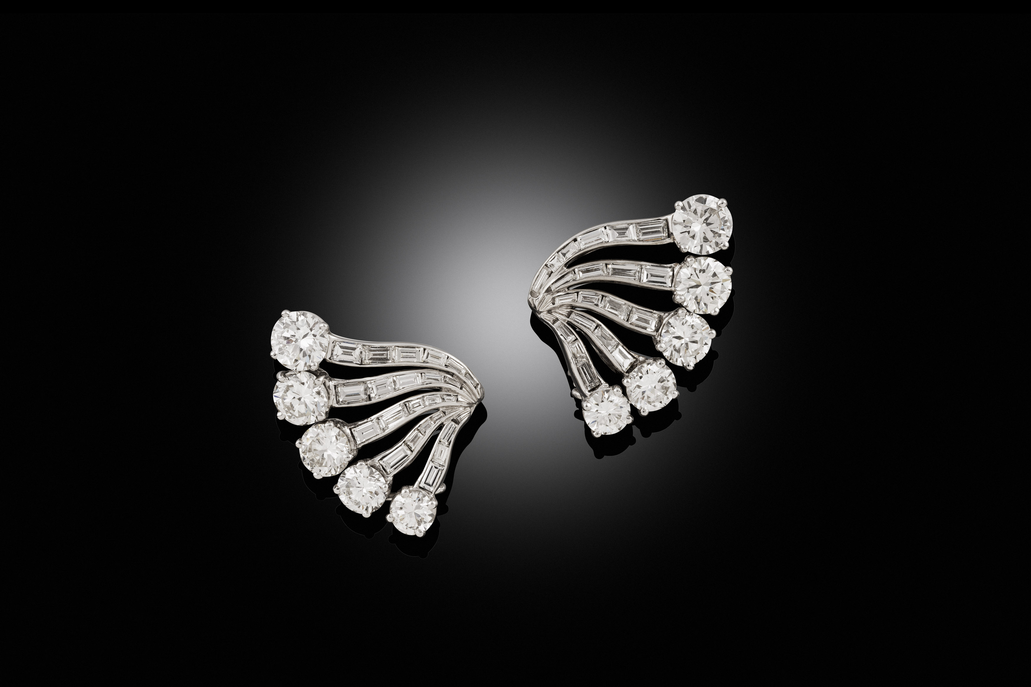 A pair of diamond ear clips, 1940s