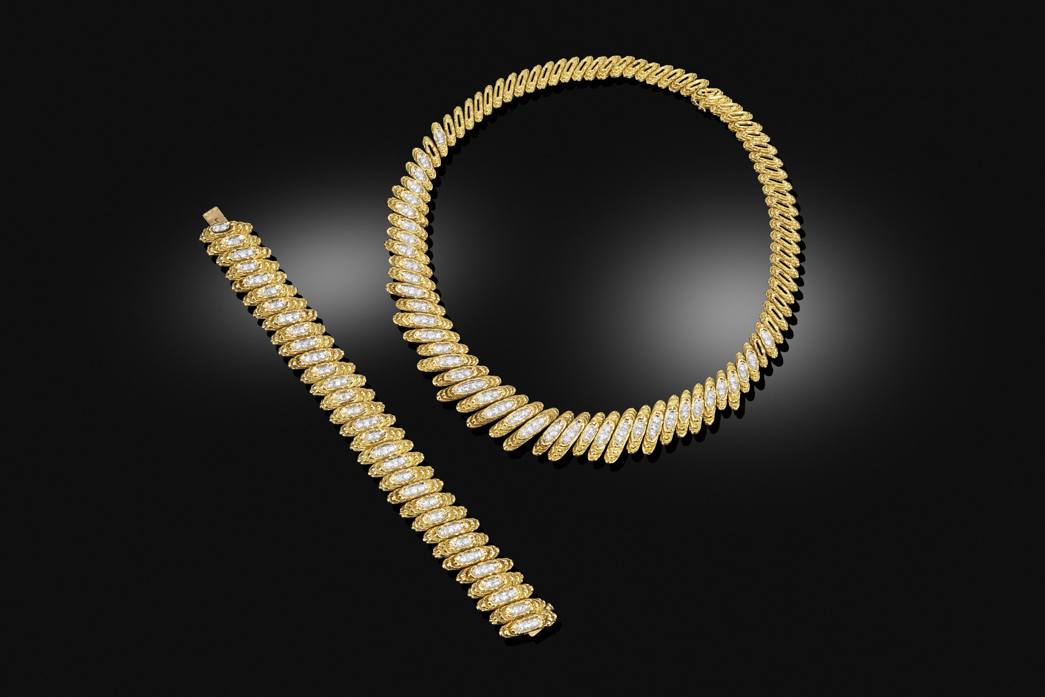 A mid-century gold and diamond suite