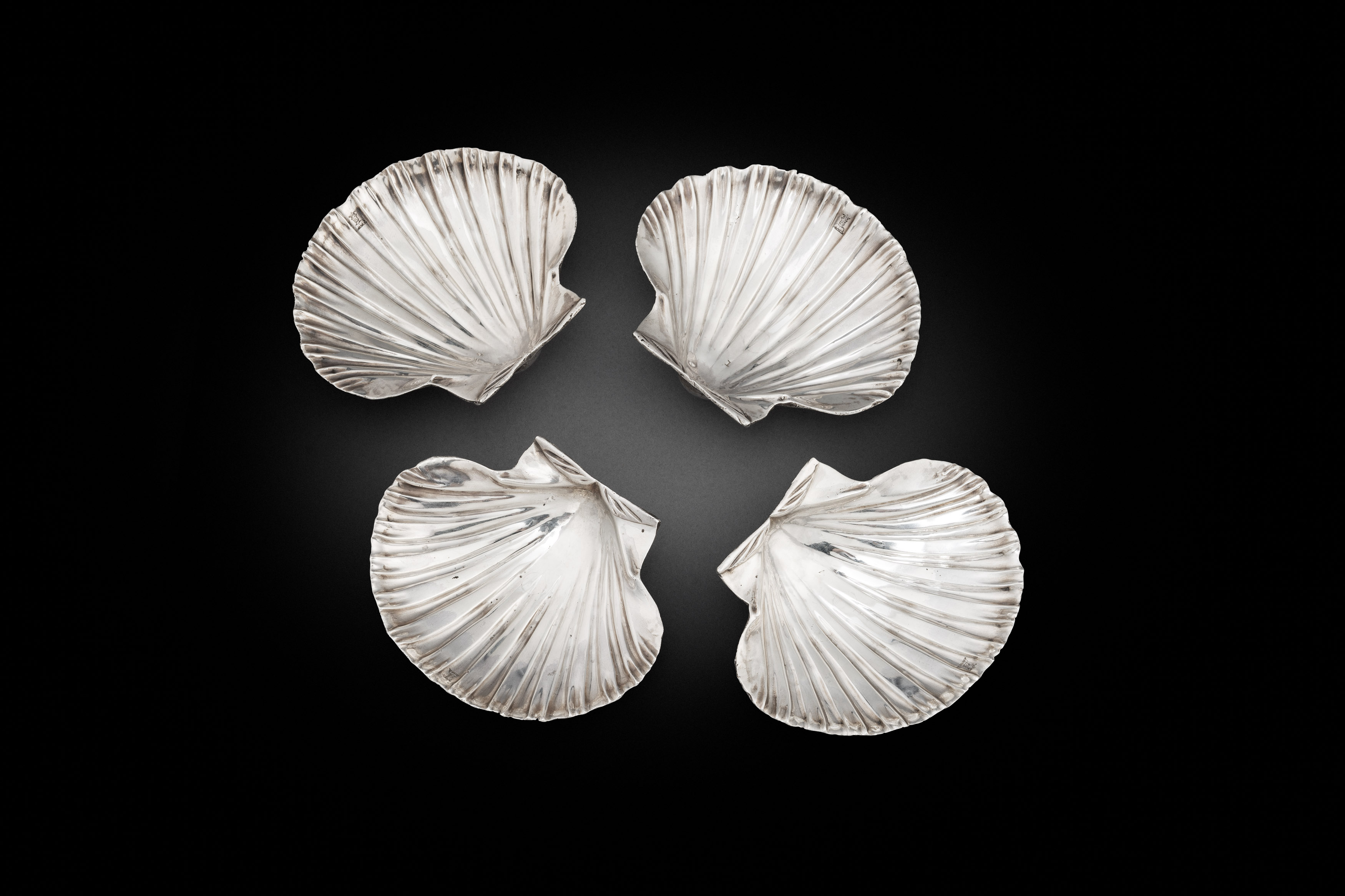 A Set of Four George II Scallop-Shell Butter Dishes